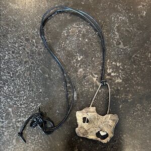 Gold Pendant on Black Leather Necklace